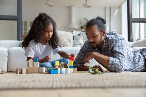 Father and daughter playing with blocks - Guide to Child Custody Concept